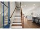 Inviting foyer with hardwood floors, staircase, and an open view to the living spaces at 209 Phillips Ln, Alpharetta, GA 30009