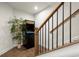 Stairway leading down to a game room with a classic arcade game and a potted plant for decor at 209 Phillips Ln, Alpharetta, GA 30009