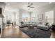 Open living room has a fireplace, hardwood floors, and comfortable seating arrangement at 209 Phillips Ln, Alpharetta, GA 30009