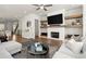 Inviting living room with fireplace, hardwood floors, and modern decor at 209 Phillips Ln, Alpharetta, GA 30009