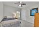 Bedroom featuring a ceiling fan, neutral walls, carpet and a framed jersey on display at 4040 Grandview Manor Dr, Cumming, GA 30028