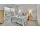 Bright bedroom with neutral walls, carpet, and light blue accents at 4040 Grandview Manor Dr, Cumming, GA 30028