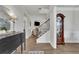 Open foyer featuring modern shiplap walls, hardwood floors, and a staircase at 4040 Grandview Manor Dr, Cumming, GA 30028