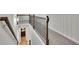 Hallway with dark wood railing, light gray carpet, and white walls at 4040 Grandview Manor Dr, Cumming, GA 30028