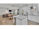 Spacious kitchen featuring white cabinets, stainless appliances, and an eat-in dining area at 4040 Grandview Manor Dr, Cumming, GA 30028