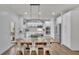 Bright kitchen with white cabinetry, stainless steel appliances, and a large dining table at 4040 Grandview Manor Dr, Cumming, GA 30028