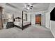 Spacious main bedroom with a four-poster bed, tray ceiling, and ample natural light at 4040 Grandview Manor Dr, Cumming, GA 30028