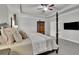 Inviting main bedroom with a four-poster bed, neutral decor, and a glimpse of an ensuite bathroom at 4040 Grandview Manor Dr, Cumming, GA 30028