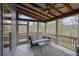 Relaxing screened porch with comfortable seating and views of nature, blending indoor comfort with outdoor serenity at 4040 Grandview Manor Dr, Cumming, GA 30028
