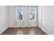 Bedroom featuring hard wood floors, modern white paint and two windows at 2036 Bixby Byway Se Dr, Atlanta, GA 30317
