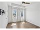 Bedroom featuring hard wood floors, modern white paint and two windows at 2036 Bixby Byway Se Dr, Atlanta, GA 30317