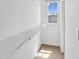 Walk-in closet with wire shelving and a window, providing ample storage and natural light at 2036 Bixby Byway Se Dr, Atlanta, GA 30317