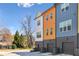 Modern townhomes with colorful exteriors and attached garages, offering stylish urban living at 2036 Bixby Byway Se Dr, Atlanta, GA 30317