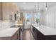 Modern kitchen featuring stainless appliances, a spacious island, and stylish pendant lighting at 2036 Bixby Byway Se Dr, Atlanta, GA 30317