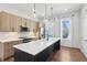 Modern kitchen with spacious island, stainless steel appliances, and contemporary lighting at 2036 Bixby Byway Se Dr, Atlanta, GA 30317
