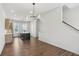 Spacious room featuring hard wood floors, eat in kitchen, island and stainless appliances at 2036 Bixby Byway Se Dr, Atlanta, GA 30317