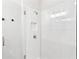 Contemporary shower with white subway tile, glass doors, and built-in niche for storage at 2036 Bixby Byway Se Dr, Atlanta, GA 30317