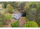 Aerial view of home on a large lot, boasting verdant trees, privacy, and natural beauty at 3960 Mason Creek Rd, Winston, GA 30187
