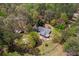Aerial view of a charming home surrounded by a canopy of trees, ensuring a private setting at 3960 Mason Creek Rd, Winston, GA 30187