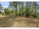 Expansive backyard with mature trees, offering ample space and privacy at 3960 Mason Creek Rd, Winston, GA 30187