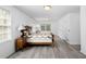 Bright bedroom with hardwood floors and neutral decor at 3960 Mason Creek Rd, Winston, GA 30187