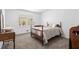Cozy bedroom with a classic wooden bed frame and natural light at 3960 Mason Creek Rd, Winston, GA 30187