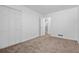 Neat bedroom with carpet, closet and attached bath, providing comfort and accessibility for relaxation at 3960 Mason Creek Rd, Winston, GA 30187