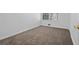 Minimalist bedroom with a neutral wall and plush carpet, presenting a blank canvas for personal touches at 3960 Mason Creek Rd, Winston, GA 30187