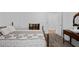 Cozy bedroom featuring a decorative quilt on the bed and classic wood furniture, exuding vintage charm at 3960 Mason Creek Rd, Winston, GA 30187