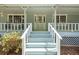Close up of the front porch with steps leading to a glass front door at 3960 Mason Creek Rd, Winston, GA 30187