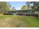 Beautiful home with a covered front porch, a green lawn, and beautiful landscaping at 3960 Mason Creek Rd, Winston, GA 30187