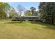 Charming one-story home with a covered front porch and beautiful landscaping at 3960 Mason Creek Rd, Winston, GA 30187