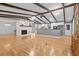 Spacious open living room with brick fireplace, exposed beams, bright lighting and hardwood floors at 3960 Mason Creek Rd, Winston, GA 30187