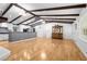 Spacious open living room with bright lighting, exposed beams and hardwood floors at 3960 Mason Creek Rd, Winston, GA 30187