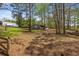 Large lot featuring multiple outbuildings, partially fenced, with mature trees and a lush green lawn at 3960 Mason Creek Rd, Winston, GA 30187