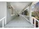 Long covered front porch with plenty of room for chairs at 3960 Mason Creek Rd, Winston, GA 30187