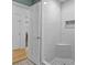 Beautiful bathroom with white tiled shower, stone flooring and seating, and a glass door entrance at 3960 Mason Creek Rd, Winston, GA 30187