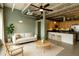 Open-concept living space features modern furnishings, an exposed ceiling, and a breakfast bar at 5200 Peachtree Rd # 3324, Chamblee, GA 30341