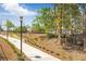 Picturesque walkway through the community, complete with vibrant mural and lush landscaping at 5200 Peachtree Rd # 3324, Chamblee, GA 30341