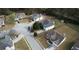 Shot of a home in a suburban neighborhood with well-kept yards and mature trees at 605 Oak Terrace Drive, Covington, GA 30016