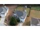 A neatly maintained two-story home with a big backyard shed and green lawn at 605 Oak Terrace Drive, Covington, GA 30016