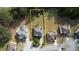 Property aerial view showing house, yard, and boundaries with beautiful tree coverage at 605 Oak Terrace Drive, Covington, GA 30016