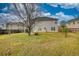 Level lot backyard featuring a well-kept lawn and privacy fencing for secure outdoor enjoyment at 605 Oak Terrace Drive, Covington, GA 30016