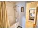 This bathroom features a shower and the doorway that leads to the bedroom at 605 Oak Terrace Drive, Covington, GA 30016