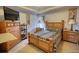 Bedroom features a wooden bed frame and a dresser with a TV on top at 605 Oak Terrace Drive, Covington, GA 30016