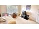 Bedroom with a twin bed, TV, and light-colored carpet flooring at 605 Oak Terrace Drive, Covington, GA 30016