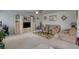 Cozy living room offering carpet, ceiling fan, couch and loveseat with accent rug and large entertainment center at 605 Oak Terrace Drive, Covington, GA 30016