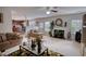 Bright living room with fireplace, couch and loveseat, and views of the kitchen with an open floor plan concept at 605 Oak Terrace Drive, Covington, GA 30016