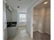 Bathroom with tiled floors, vanity with solid surface countertop and spacious closet at 195 14Th St # 1005, Atlanta, GA 30309