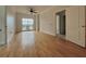 Bright bedroom with hardwood flooring, ceiling fan, and a sliding door to the balcony at 195 14Th St # 1005, Atlanta, GA 30309